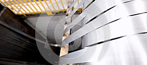 Rolled steel. Stack of rolls, cold rolled steel coils in action