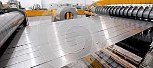 Rolled steel. Stack of rolls, cold rolled steel coils in action