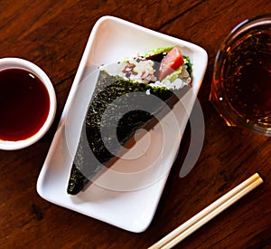 Rolled temaki sushi. Traditional japanese cuisine