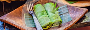 Rolled thin green colored pancake Traditional indonesian food BANNER, LONG FORMAT