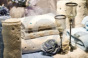 Rolled Towels, Blue Roses and Candle Holders
