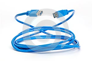 Rolled up blue USB 3 extension cable.