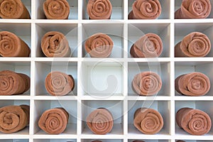 Rolled up brown spa towels