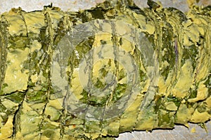 Rolled Up Dasheen Bush Leaves with Split Pea Batter which is Fried to Make Saheena