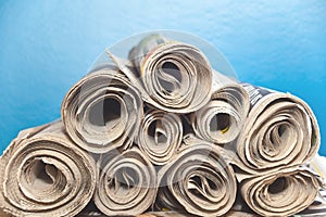 Rolled up Newspapers in a stack