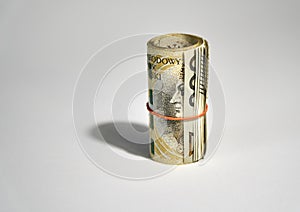 Rolled up polish money PLN - two hundred polish zloty bills isolated on a white background