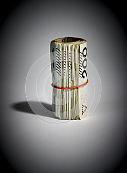 Rolled up polish money PLN - two hundred polish zloty bills isolated on a white background