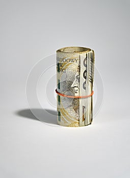 Rolled up polish money PLN - two hundred polish zloty bills isolated on a white background