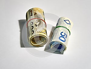 Rolled up polish money PLN - two hundred polish zloty bills isolated on a white background