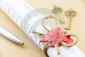 Rolled up scroll of Last will and testament that fastened with natural brown jute twine hemp rope. photo