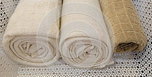 Rolled Up White and Brown Bath Towels