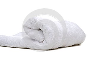 A rolled up white towel