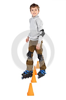 Roller boy clears obstacles cones looking
