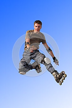 Roller boy jumping from parape