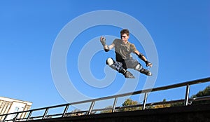 Roller boy jumping from parapet