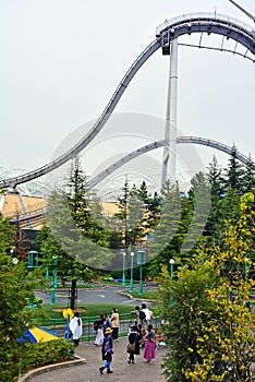 Roller coaster loop design ride with surrounding trees at Universal Studios Japan in Osaka, Japan