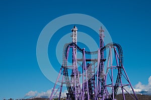 Roller coaster ride in an amusement Park. Background, postcard