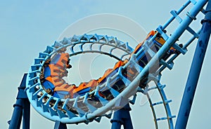 Roller coaster ride filled with thrill seekers photo