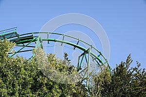 Roller coaster track on blue sky background