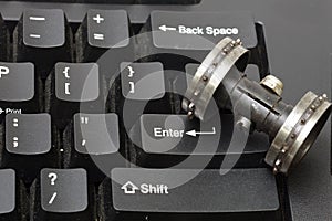 A roller perf sprocket on the enter key pad is concept to the crush.