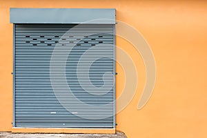 Roller Shutter Door on Yellow Wall.