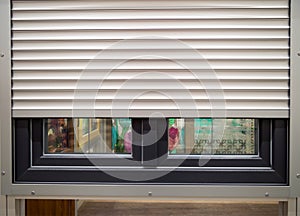 Roller shutters installed on a plastic window