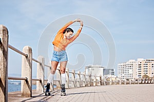 Roller skate, stretching and banner with a girl at the promenade on a blue sky background for the weekend. Fitness