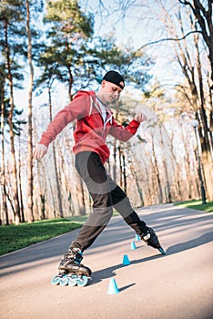 Roller skater, trick exercise in park