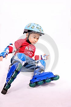 Roller skating boy falling down