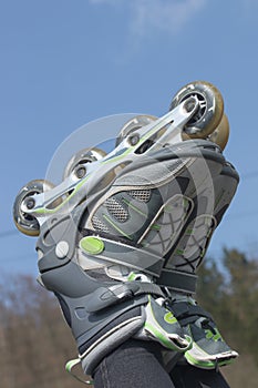 Rollerblades against a blue sky