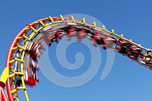 Rollercoaster against blue sky