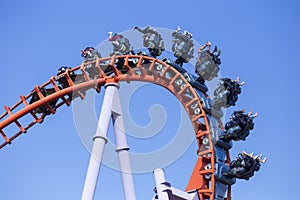 Rollercoaster ride with blue sky