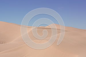 Rolling desert sand dunes