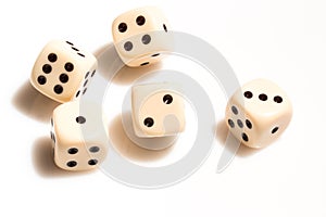 Rolling dice on white tabletop