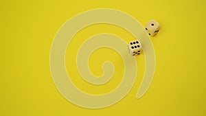 Rolling Dice on Yellow Background as Gambling and Probability concept, Throwing Dice