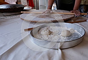 rolling dough with a rolling pin