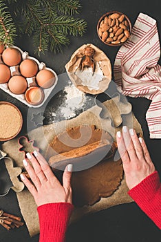 Rolling gingerbread cookie dough. Christmas baking concept