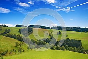 Rolling green hills of Germany with blue sky