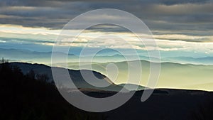 Rolling hills and mountains at autumn sunset, view from Bobija mountain