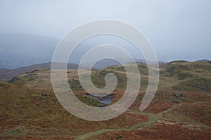 Rolling moorland with small lake tarn: typical of north Britain - English Lake District