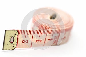 Rolling out measuring tape, on its side
