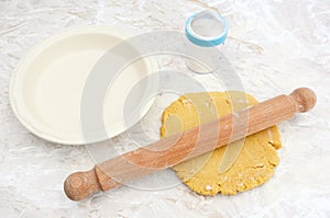 Rolling out shortcrust pastry for a pie photo