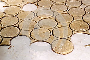 Rolling pin with dough on kitchen table. Preparing dough round t