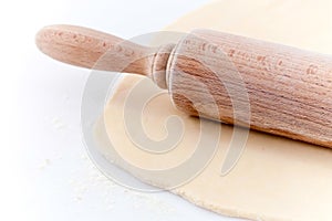 Rolling pin flattening dough