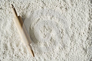 Rolling pin and flour background