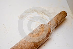 Rolling pin on the table with flour