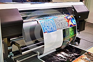 Rolling plotter printer in work photo