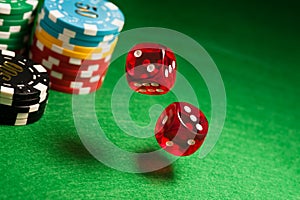Rolling red dice on a casino table