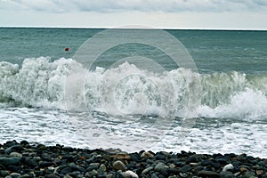 Rolling sea waves crashing beach