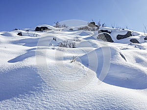 Rolling Snow Hills with Sunshine and Blue Sky in Yakima, Washington